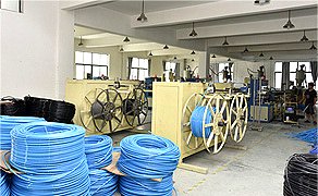 Extrusion line winding blue PU tube onto reels